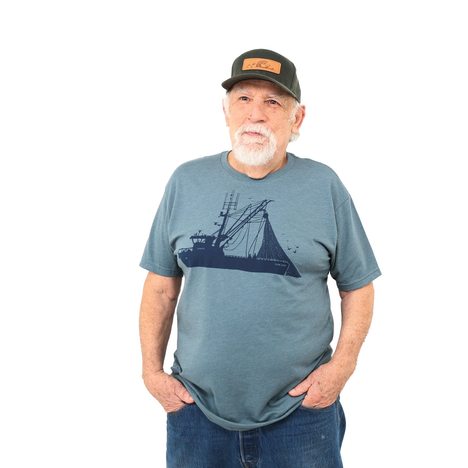 man wearing ball cap and light blue shirt with dark blue ink of a seiner