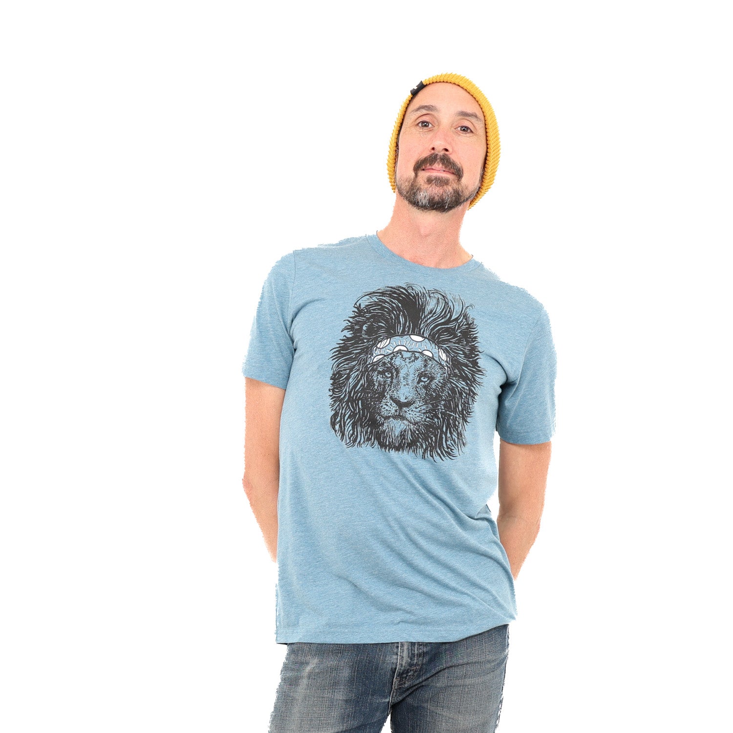 Man is wearing a steal blue tee with a screen printed lion wearing a headband on it.