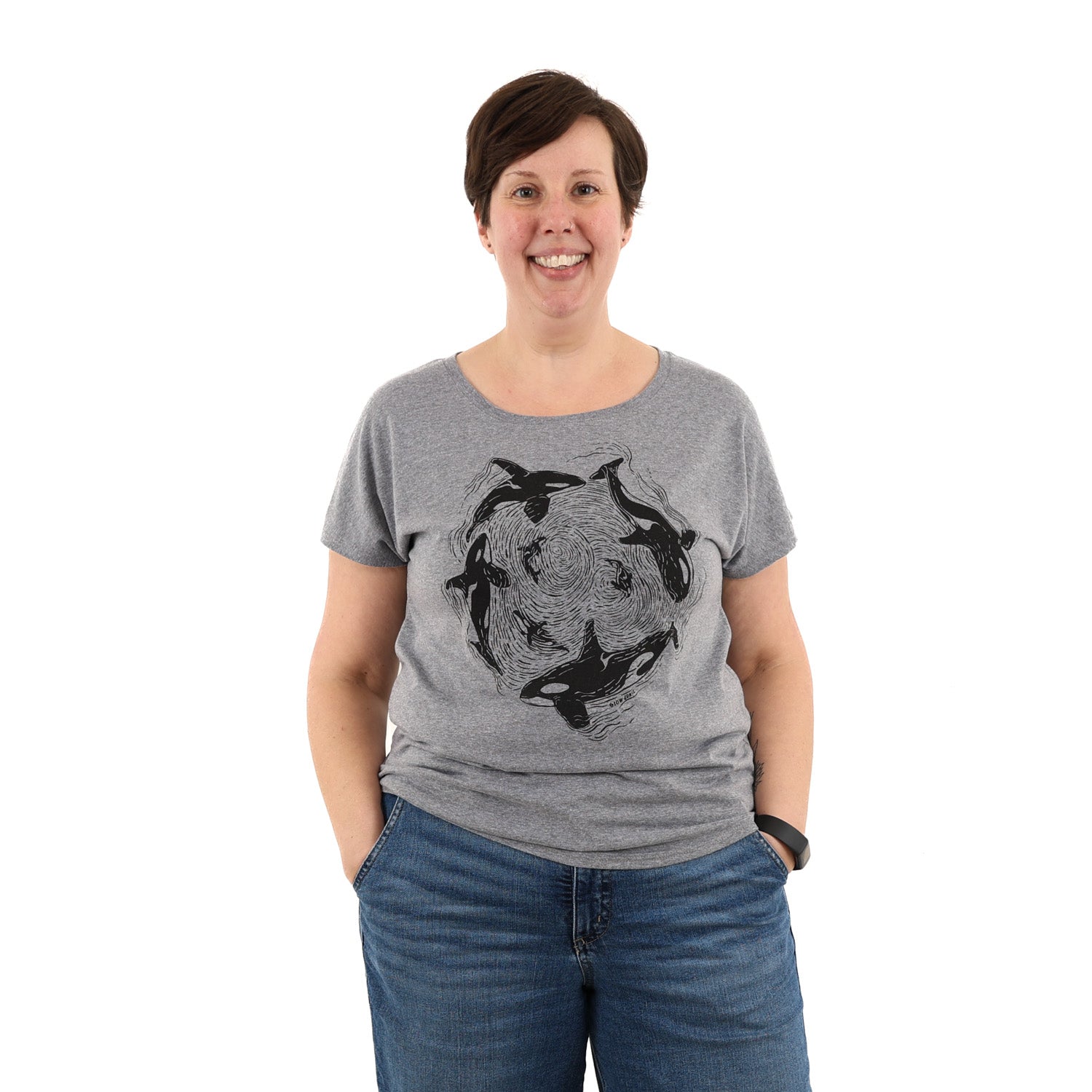 Woman wearing relax fit grey t shirt with orca whales printed in black ink
