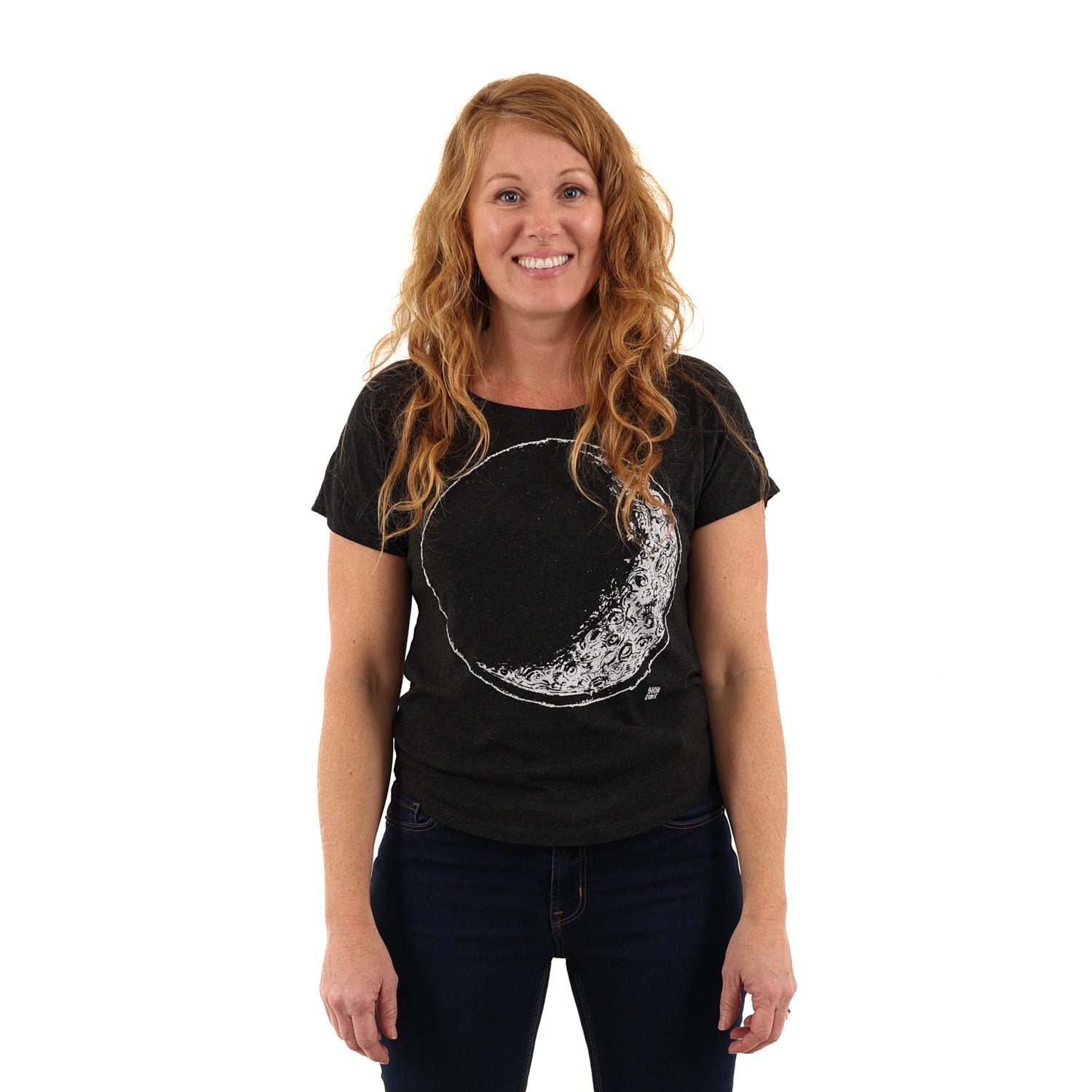 Woman wearing a black t shirt with crescent moon printed in white ink