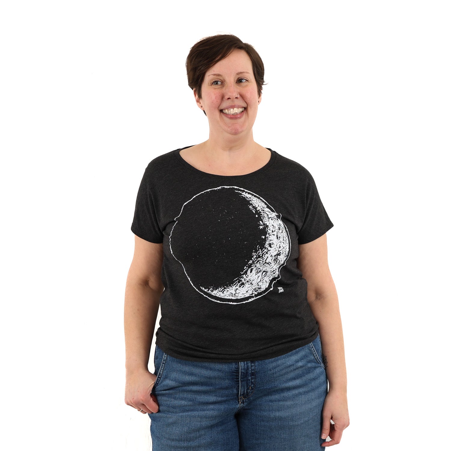 Woman wearing a black t shirt with crescent moon printed in white ink