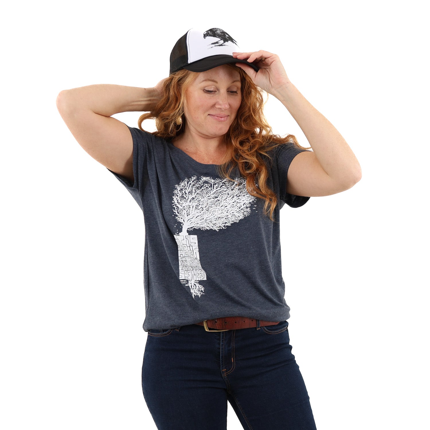 Woman wearing loose fitted blue t shirt with white print