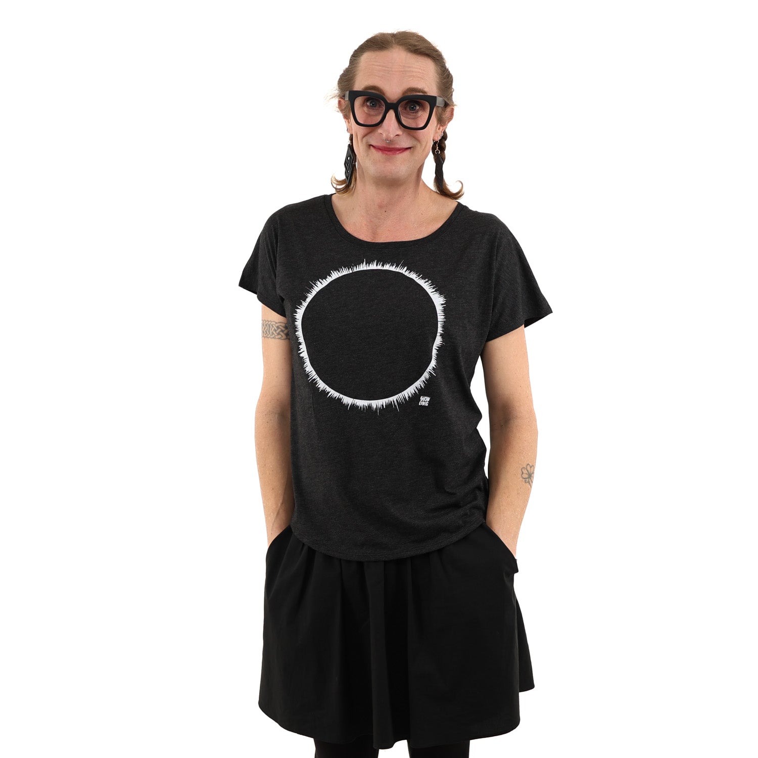 Woman wearing a black t-shirt with white ink of an eclipse. 