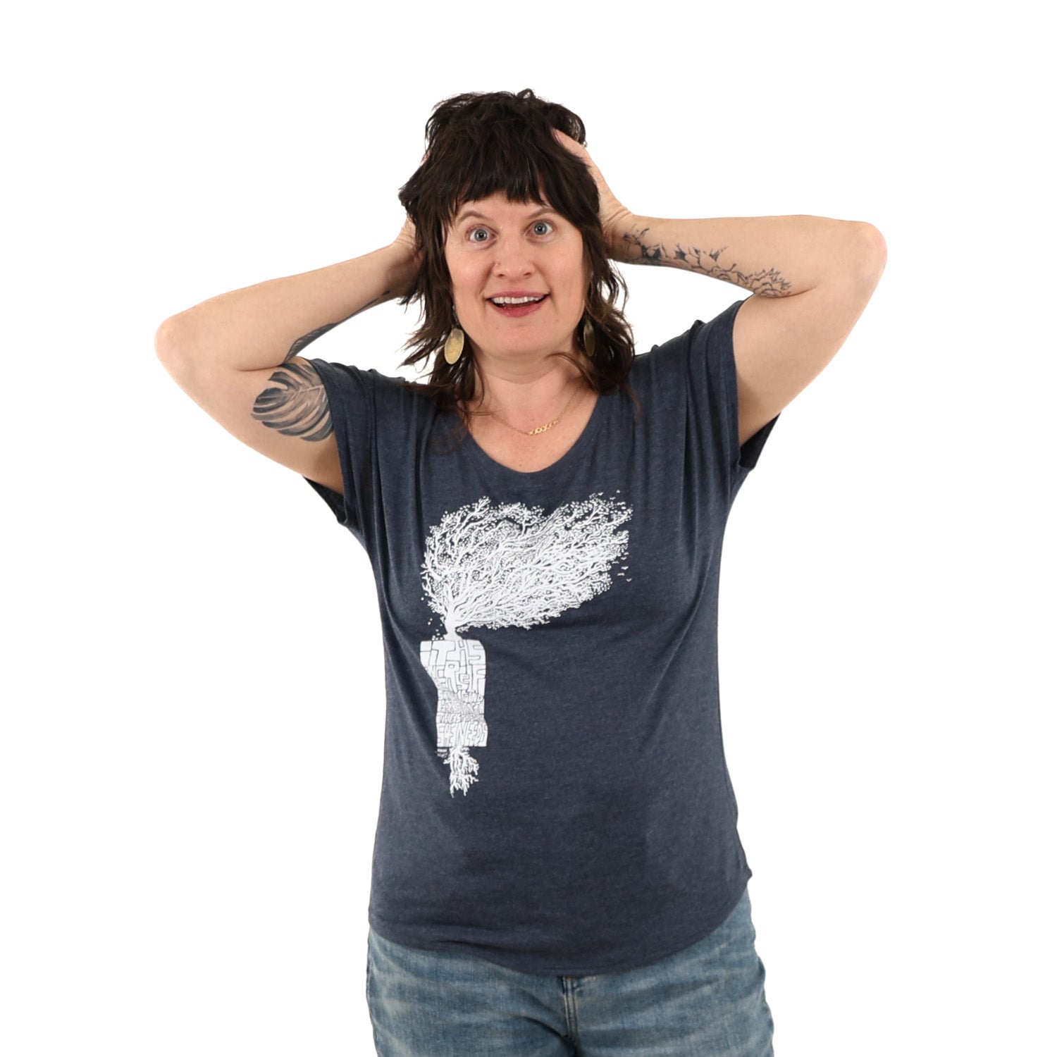 Woman wearing loose fitted blue t shirt with white print