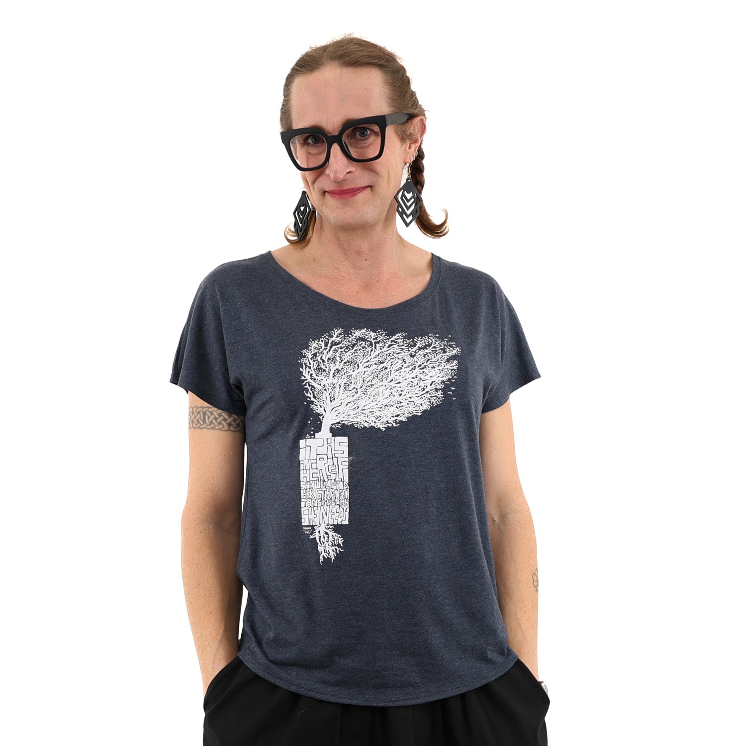 Woman wearing loose fitted blue t shirt with white print