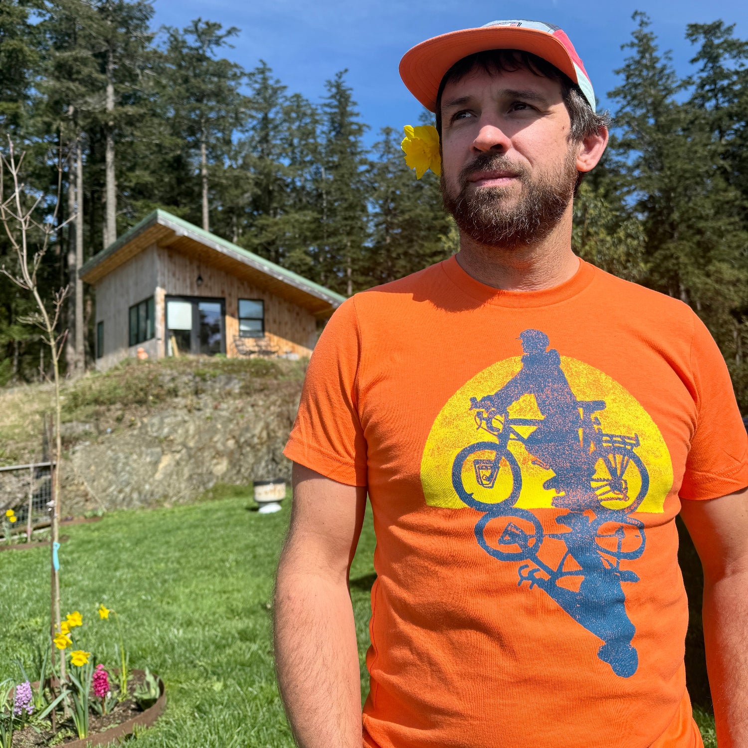 man with orange t shirt