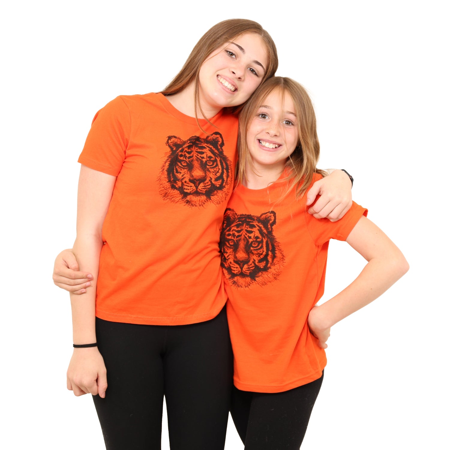 two girls with arms around eachother while wearing Slow Loris Tiger T