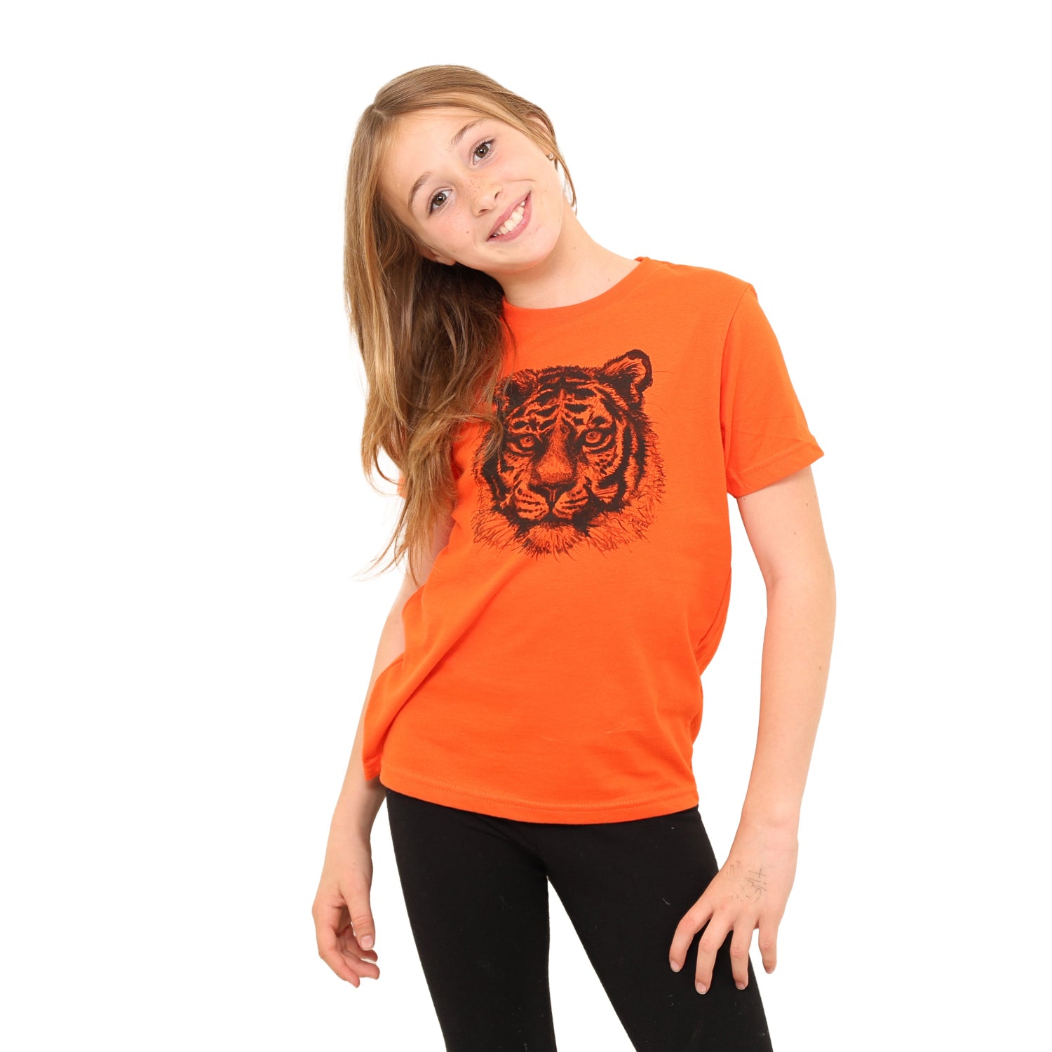 Girl wearing orange t shirt with tiger print