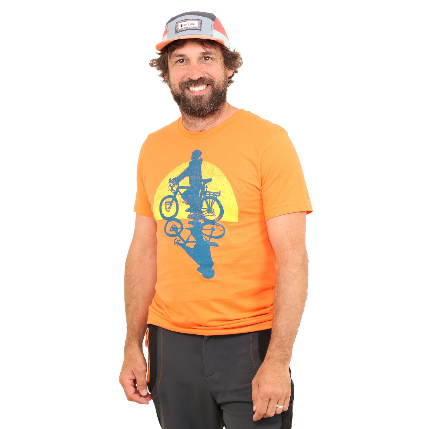 man in white backdrop with Slow Loris Evening Ride T shirt