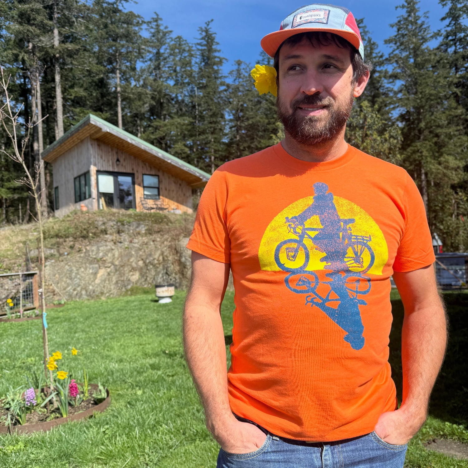 man wearing orange bike shirt