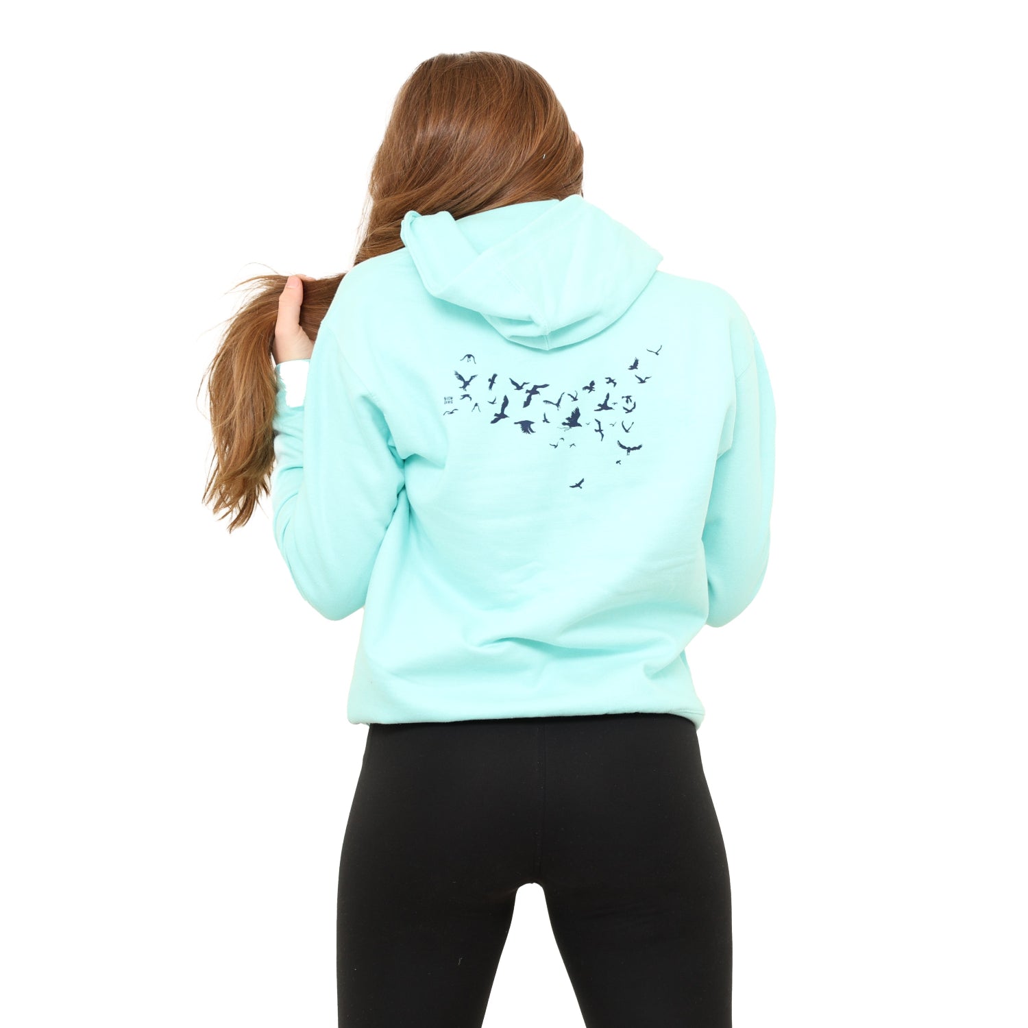 girl with back turned, holding hair, showing back of the hoodie