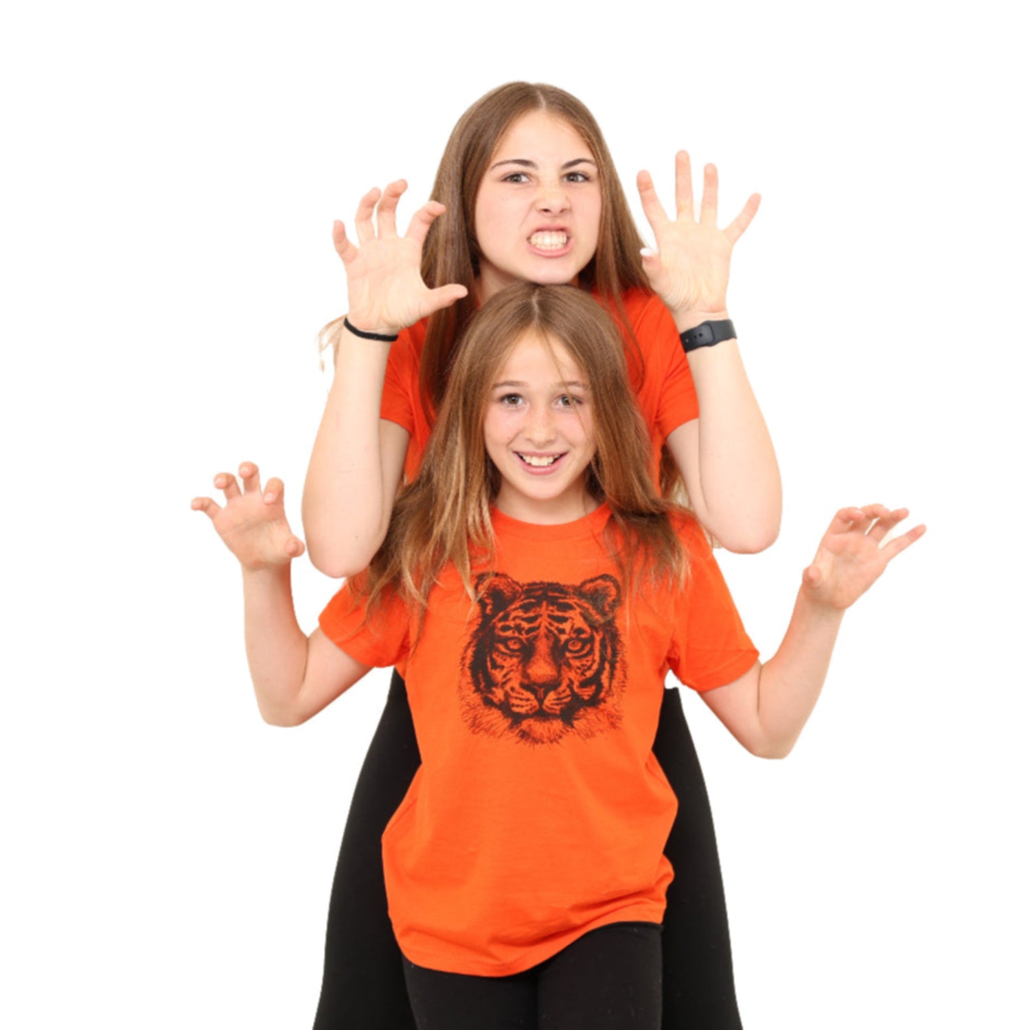 two girls making roar expressions