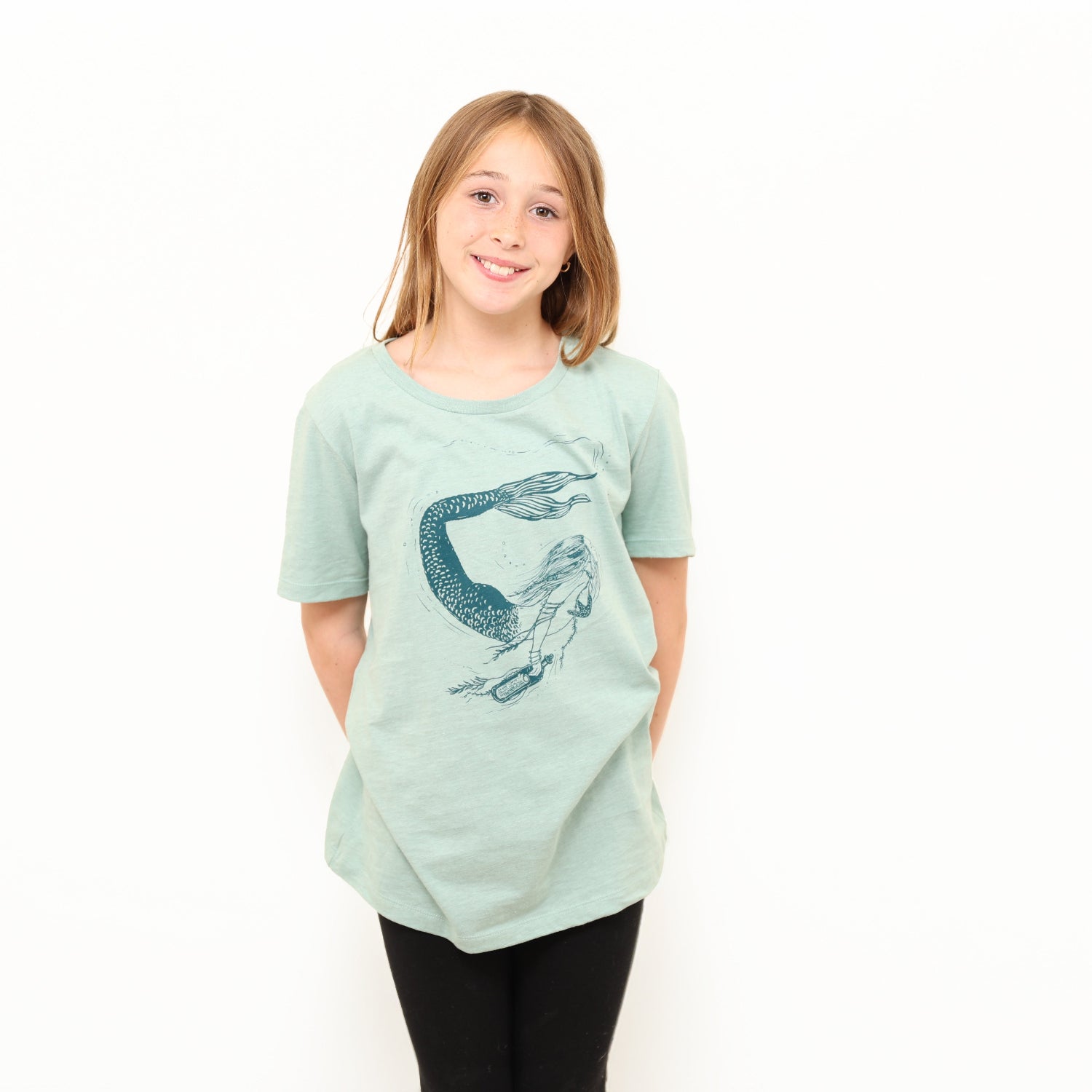 girl wearing mermaid shirt