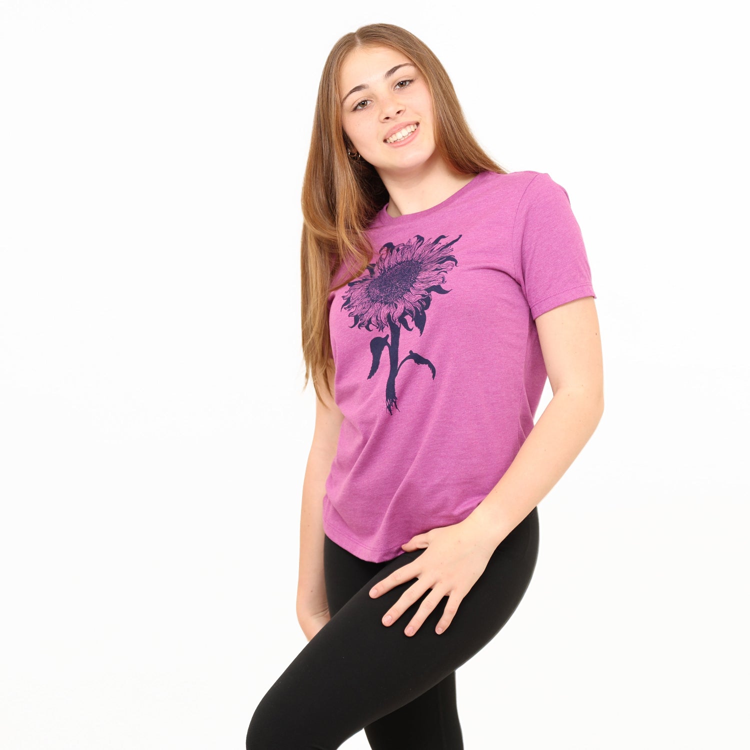 girl wearing magenta t-shirt with sunflower print on it.