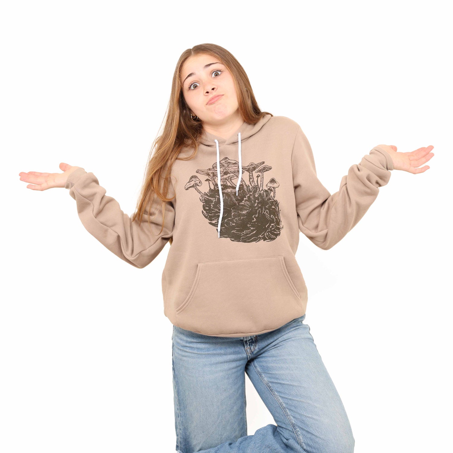 Girl standing in a white background wearing unisex shroom cone pullover hoodie
