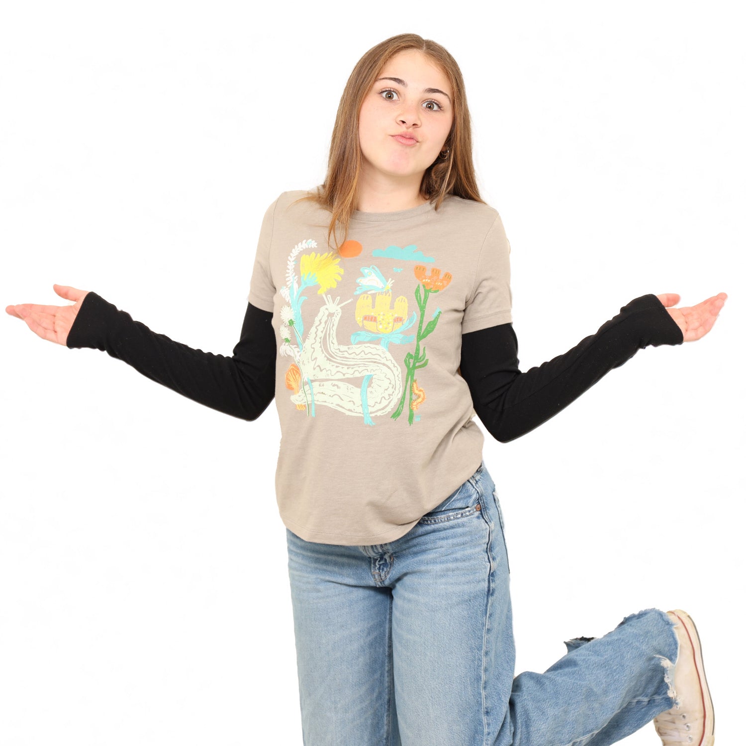 girl wearing t shirt with arms out and white background