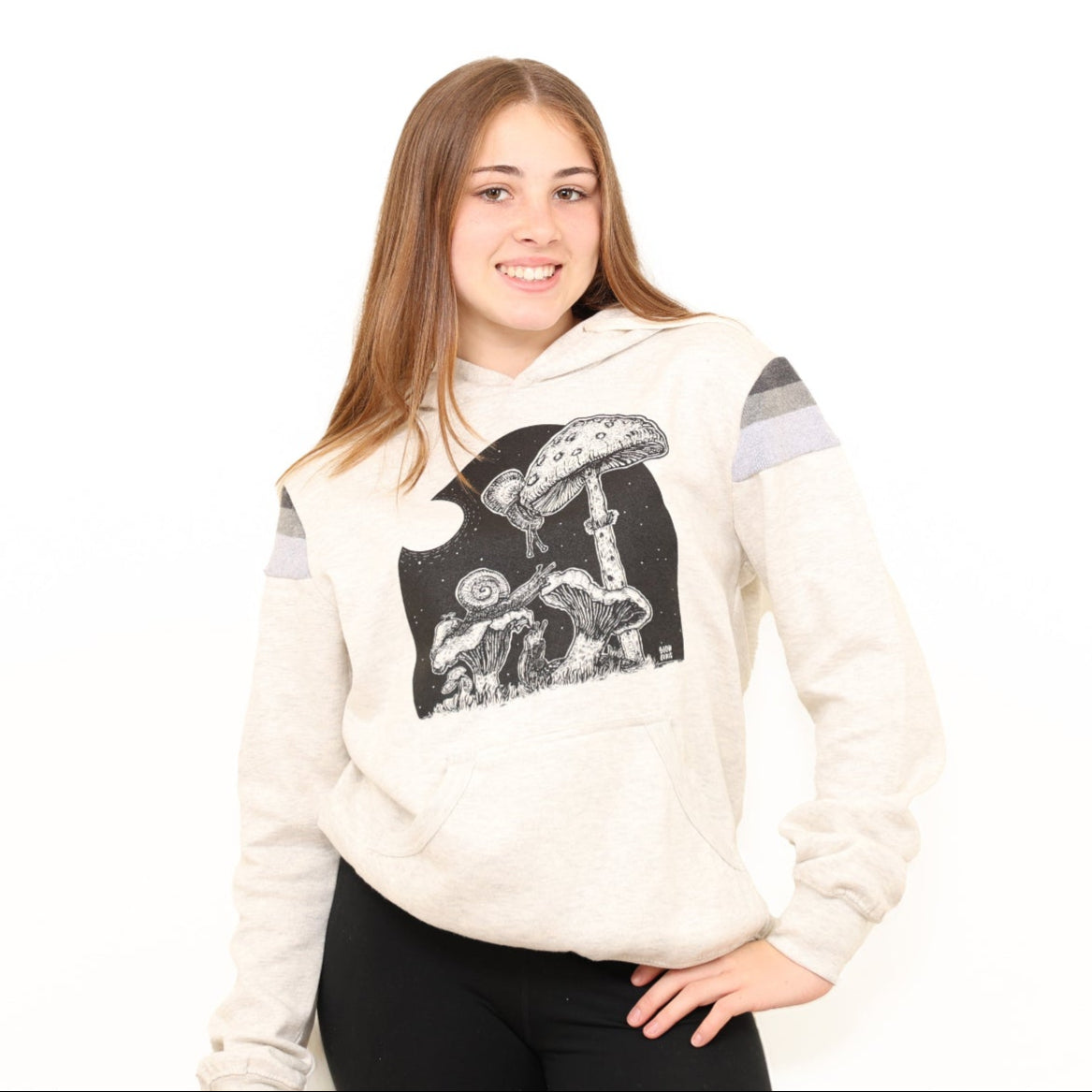 girl wearing a slow loris full moon buffet hoodie. Snails are eating the mushrooms in the print