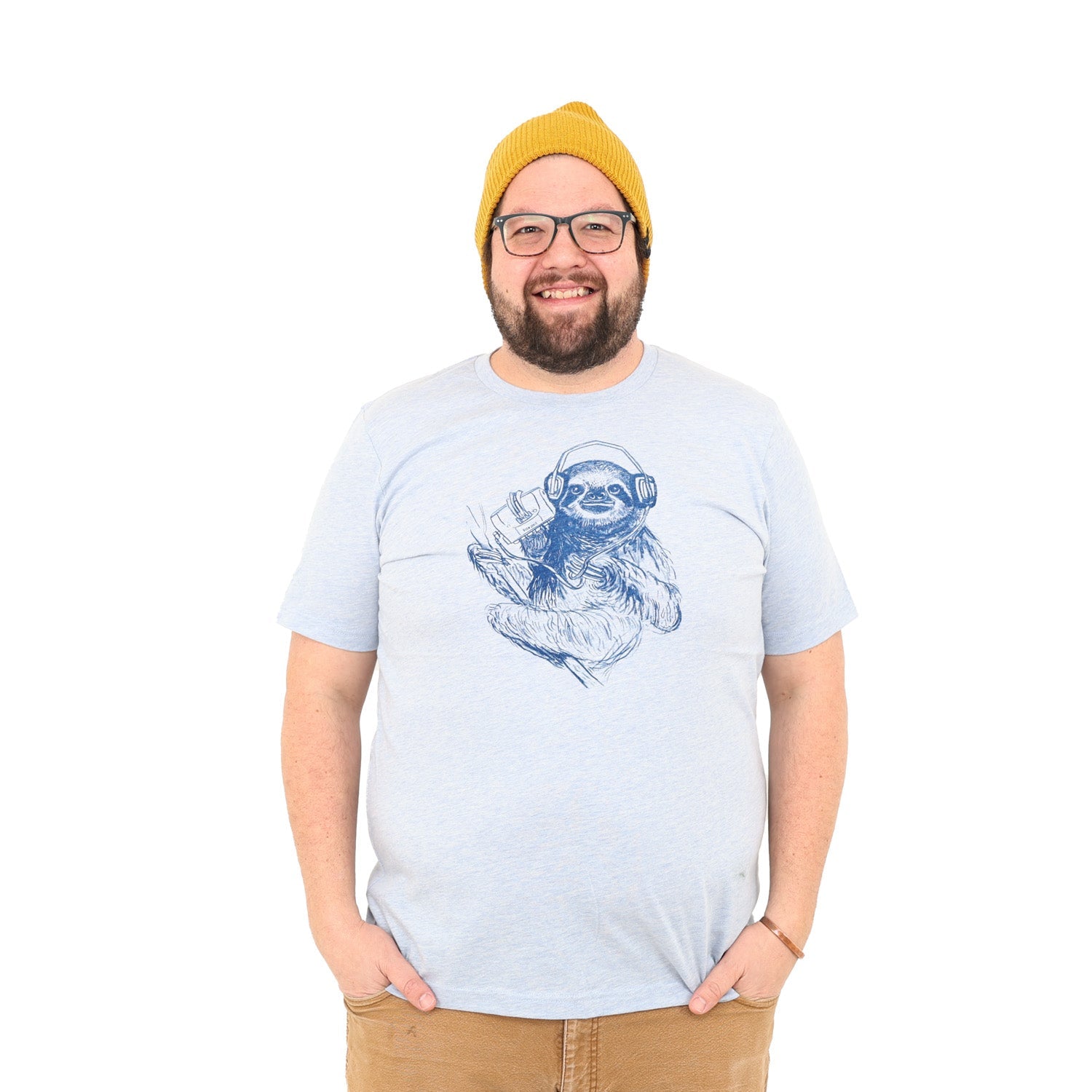 light blue shirt with dark blue screen print of a sloth listening to music on headphones.