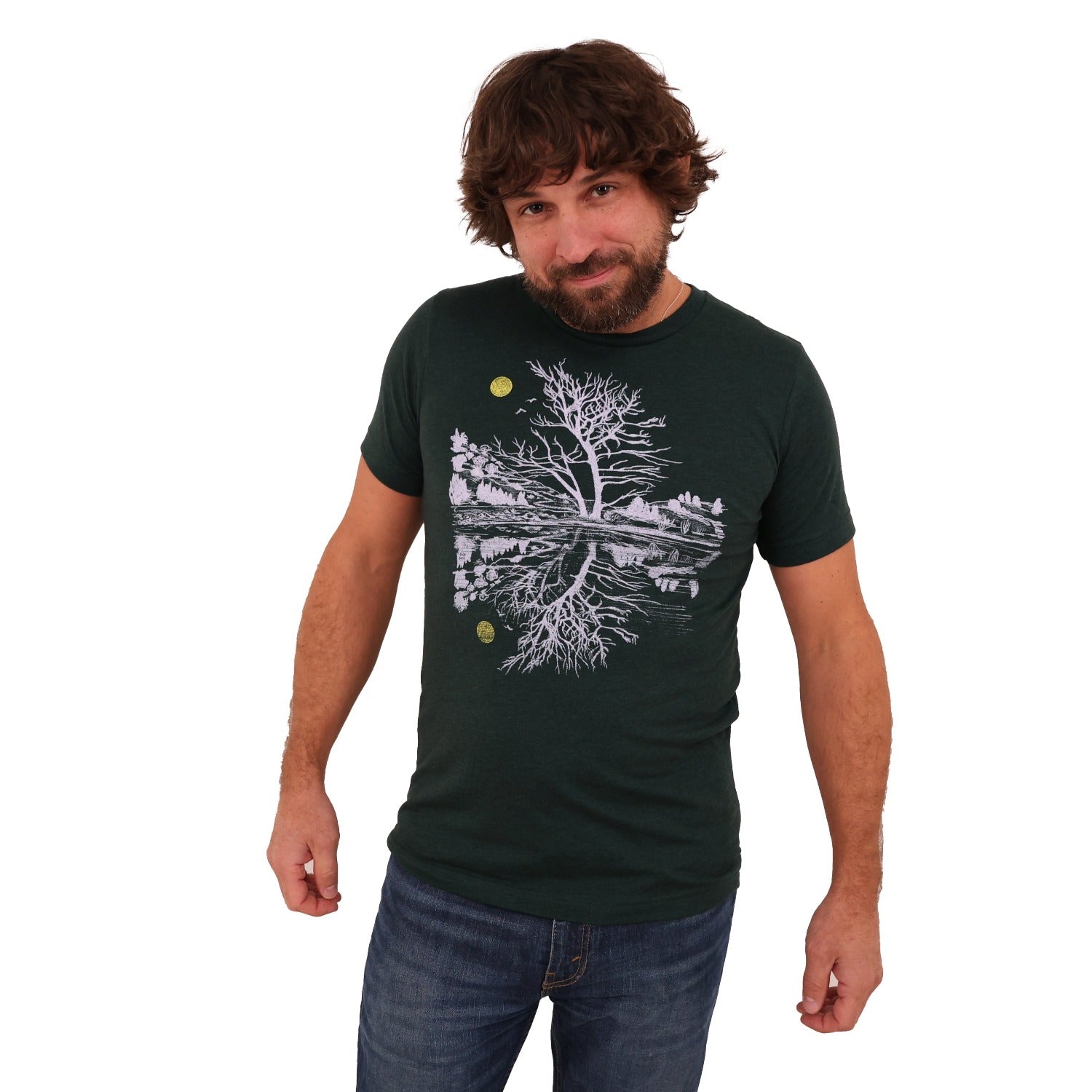 Man wearing green t-shirt and light ink and a yellow moon with scene reflecting over water.