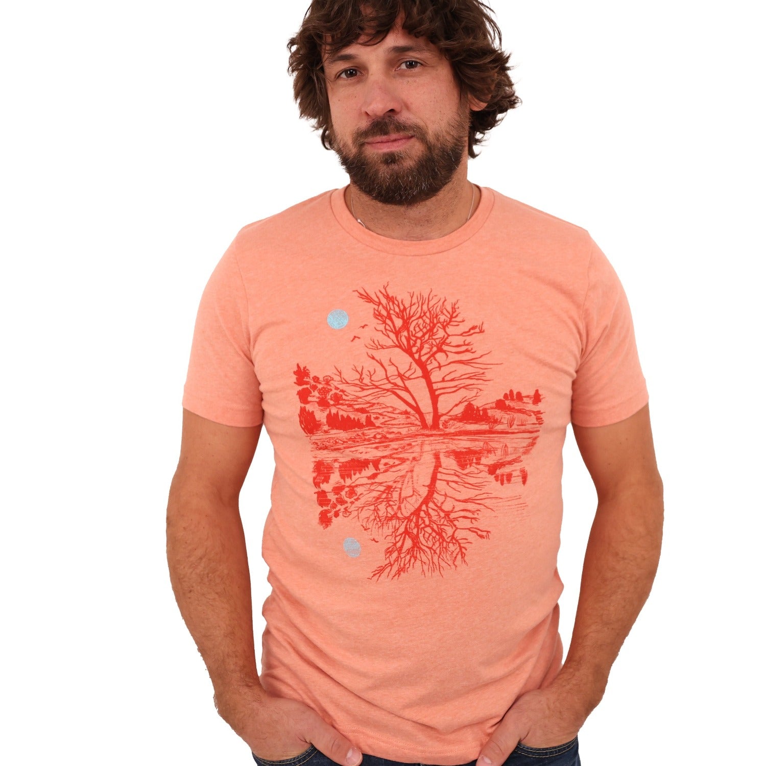 man wearing sunset orange t-shirt with darker orange print of moon and scene reflection over water.