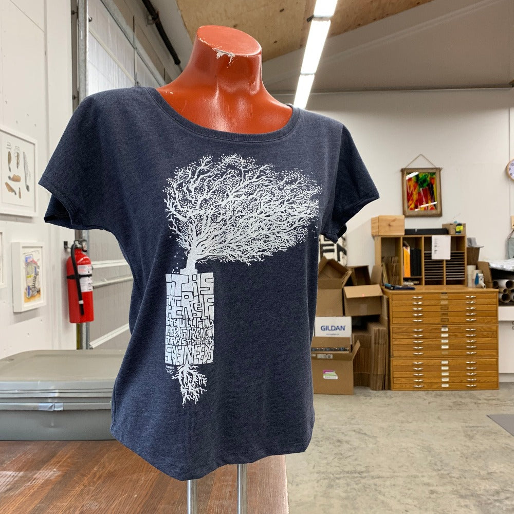 Manikin wearing loose fitted blue t shirt with white print