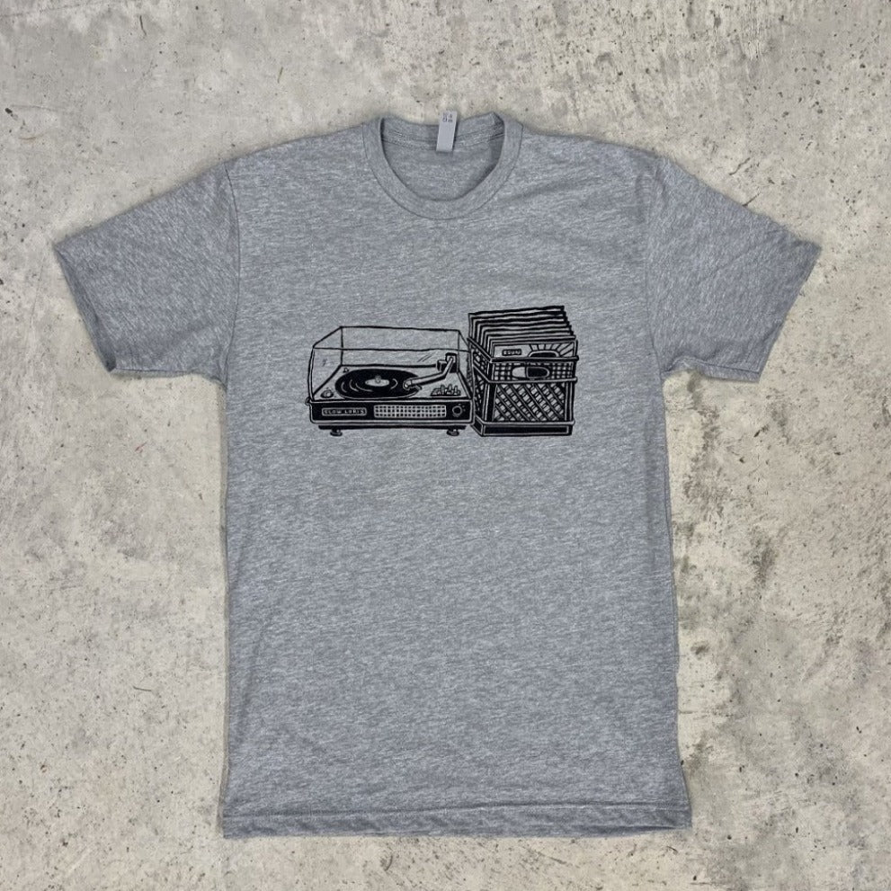 grey shirt with black print of a record player with a milk crate full of records next to it.