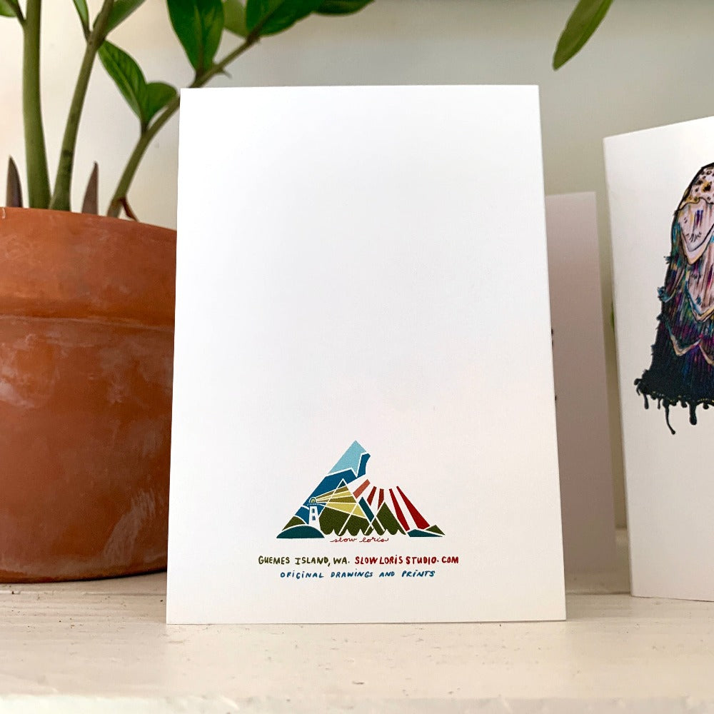 The back of a greeting card, printed with the Slow Loris brand logo and address. .