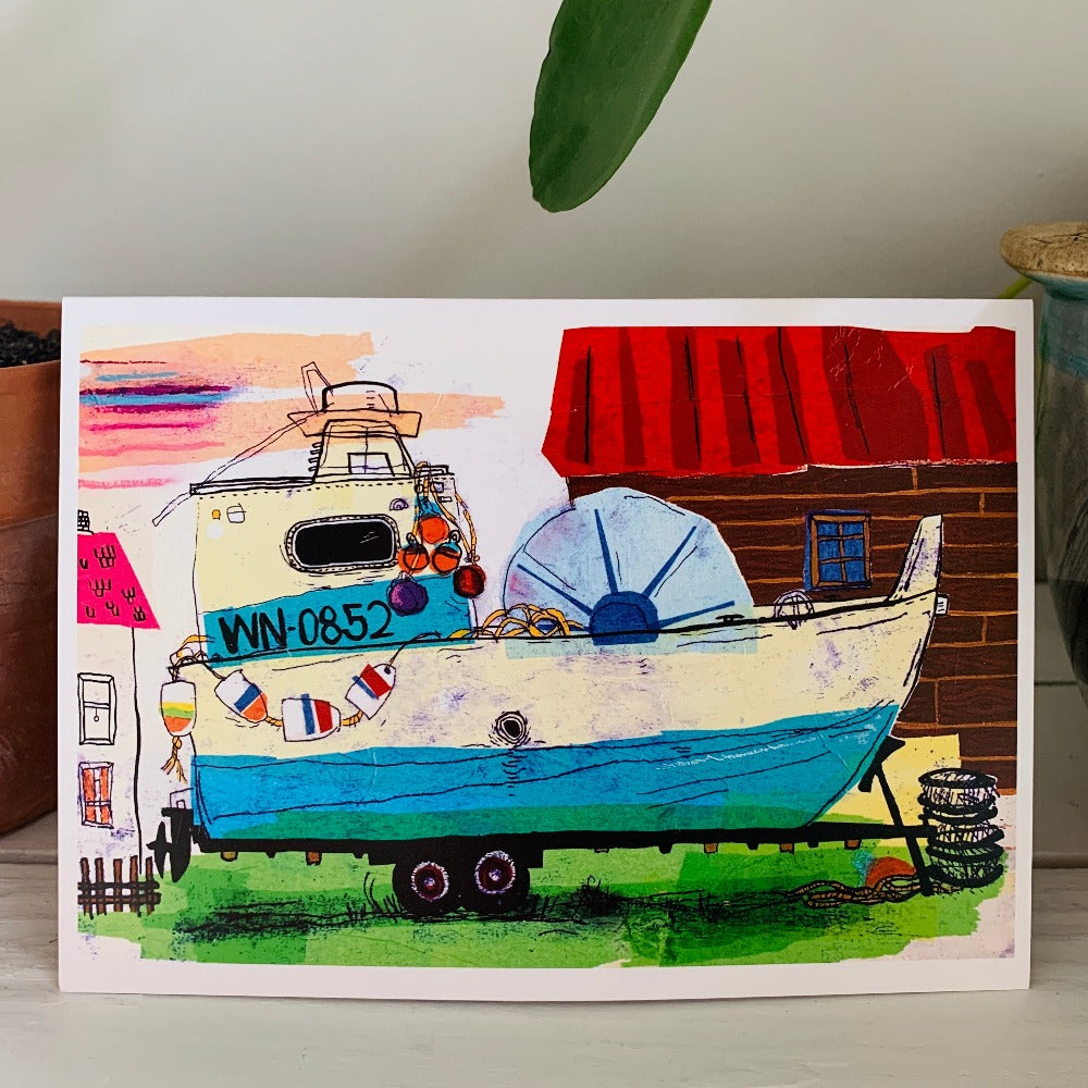A greeting card featuring a colorful painting of an old fishing boat in a yard. Part of our Island Life series.