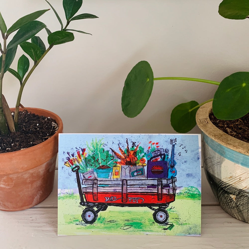 Greeting card printed with a colorful painting of a wagon full of groceries.