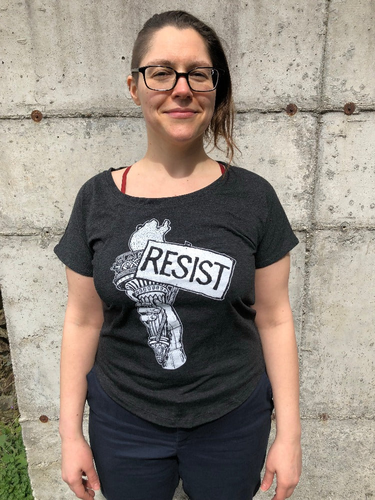 resist tee on a women, resistance, resist sticker, dump trump, Anti-Elon Musk, gay love, gay rights, protect trans kids, protect lgqtq rights, fuck trump, fuck musk, cyberpunk resistance, fascist billionaire, black maga hat, maga Elon hat, Elon Musk is a fascist sticker, anti-authoritarian tech sticker, resist billionaire control decal, no billionaires no fascism sticker, stop tech overlords sticker, anti-censorship sticker, laptop sticker,