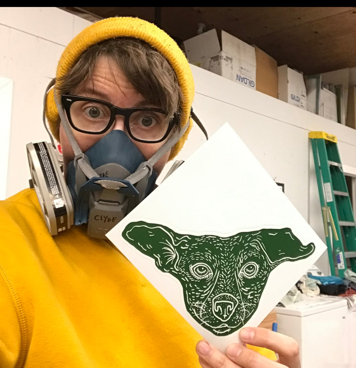 Team Slow member Clyde, holding our Dog Island sticker.