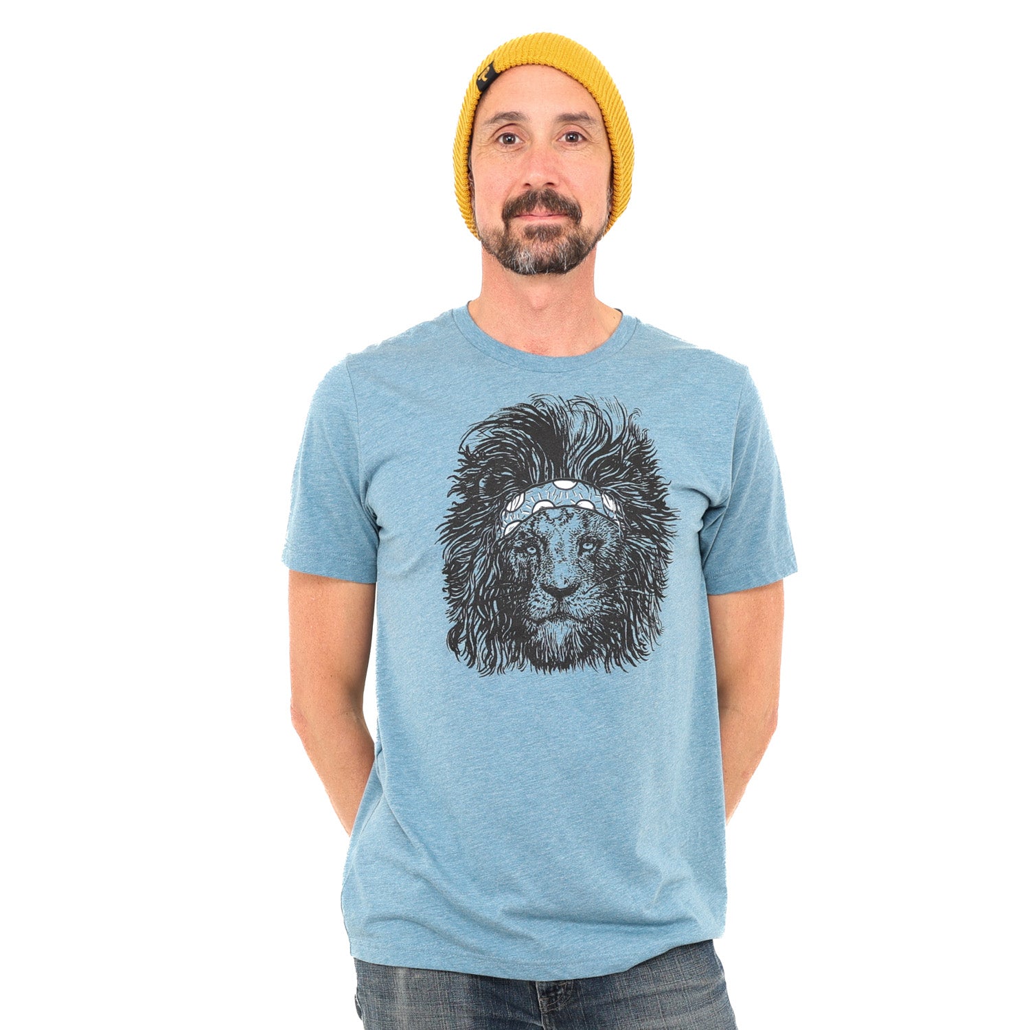 Man is wearing a steal blue tee with a screen printed lion wearing a headband on it.
