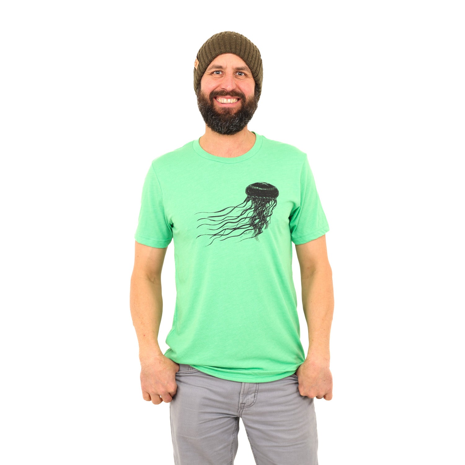 Man with beard and beanie wearing a bright green t-shirt with a black jellyfish print across the chest