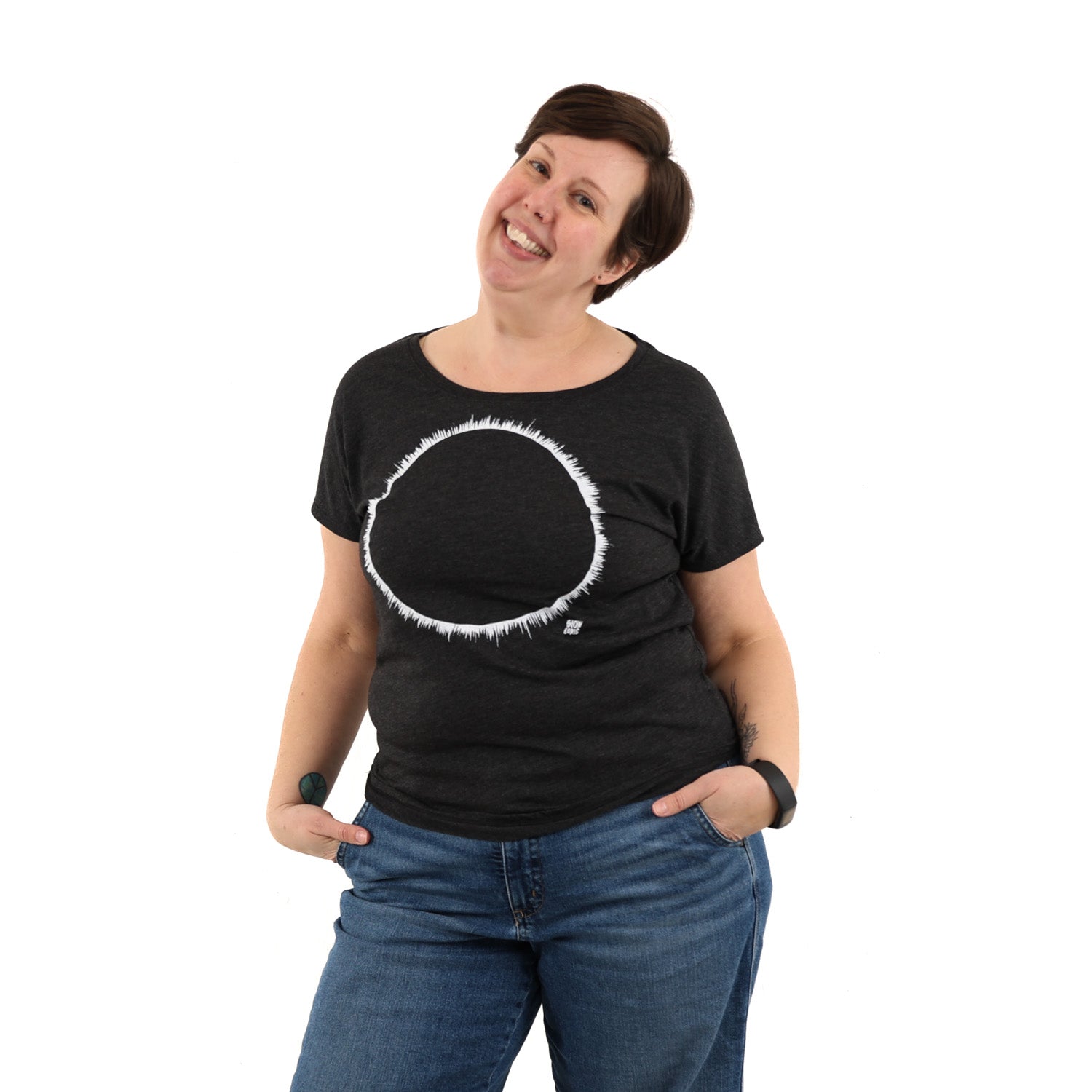 Woman wearing a black t-shirt with white ink of an eclipse.