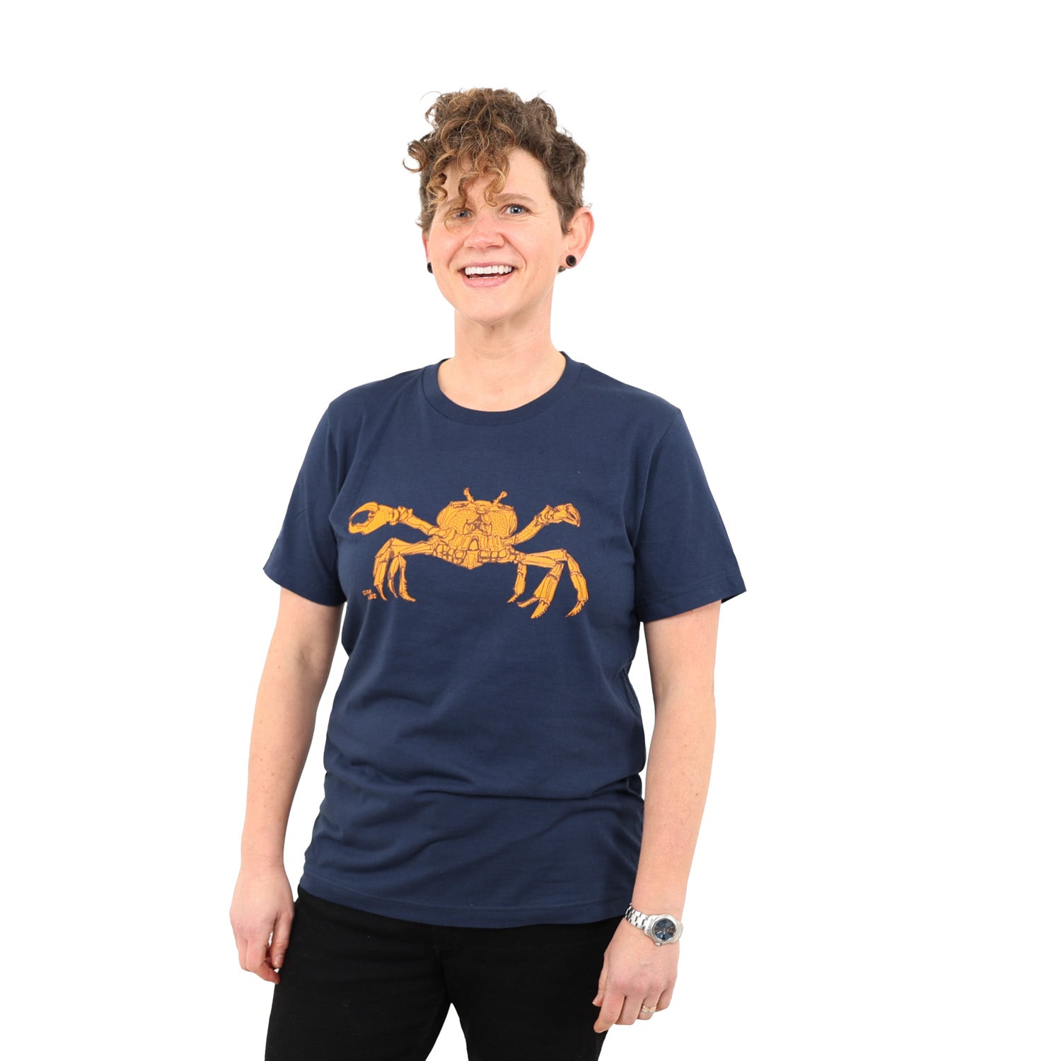 gril smiling wearing blue t-shirt with crab screen printed on it. 