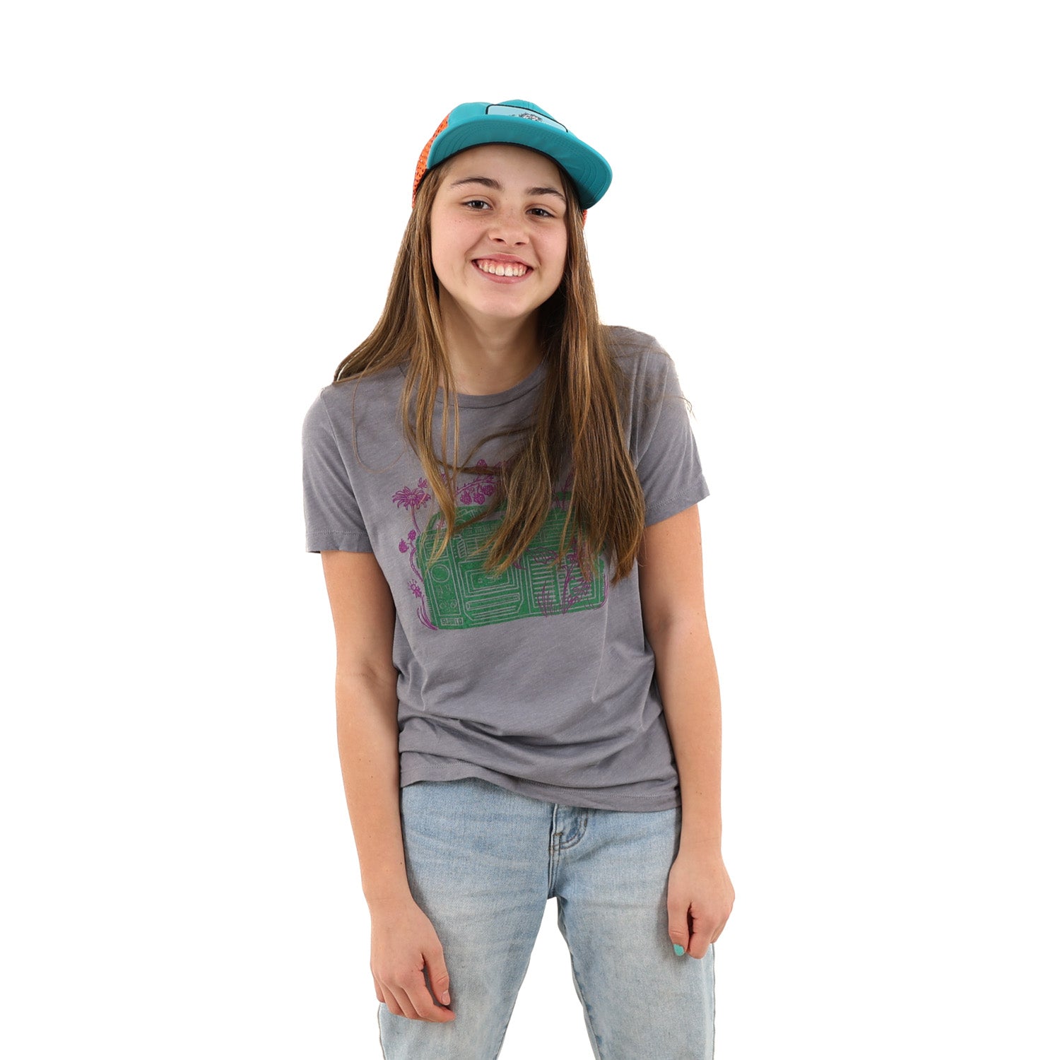 girl wearing a hat and a slow loris grey t shirt with pink/purple plants and green radio