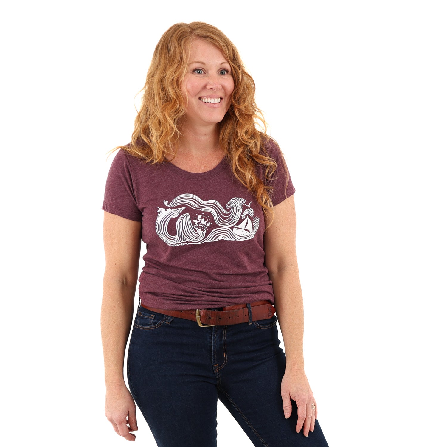 Woman wearing maroon shirt with a drawing stormy seas printed in white -