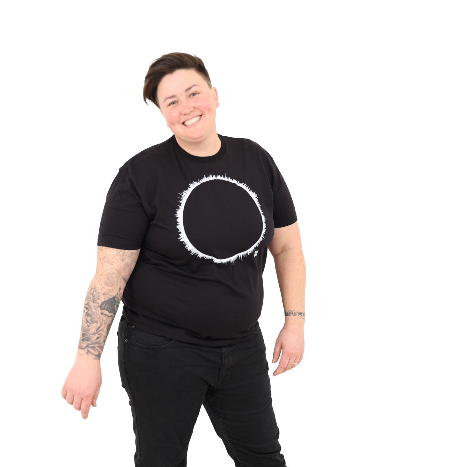 woman with white background wearing a black t-shirt with white eclipse print on it.