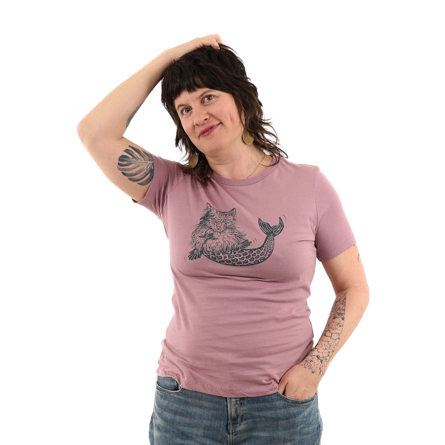 Lady wearing pink shirt with mermaid kitty printed on green ink