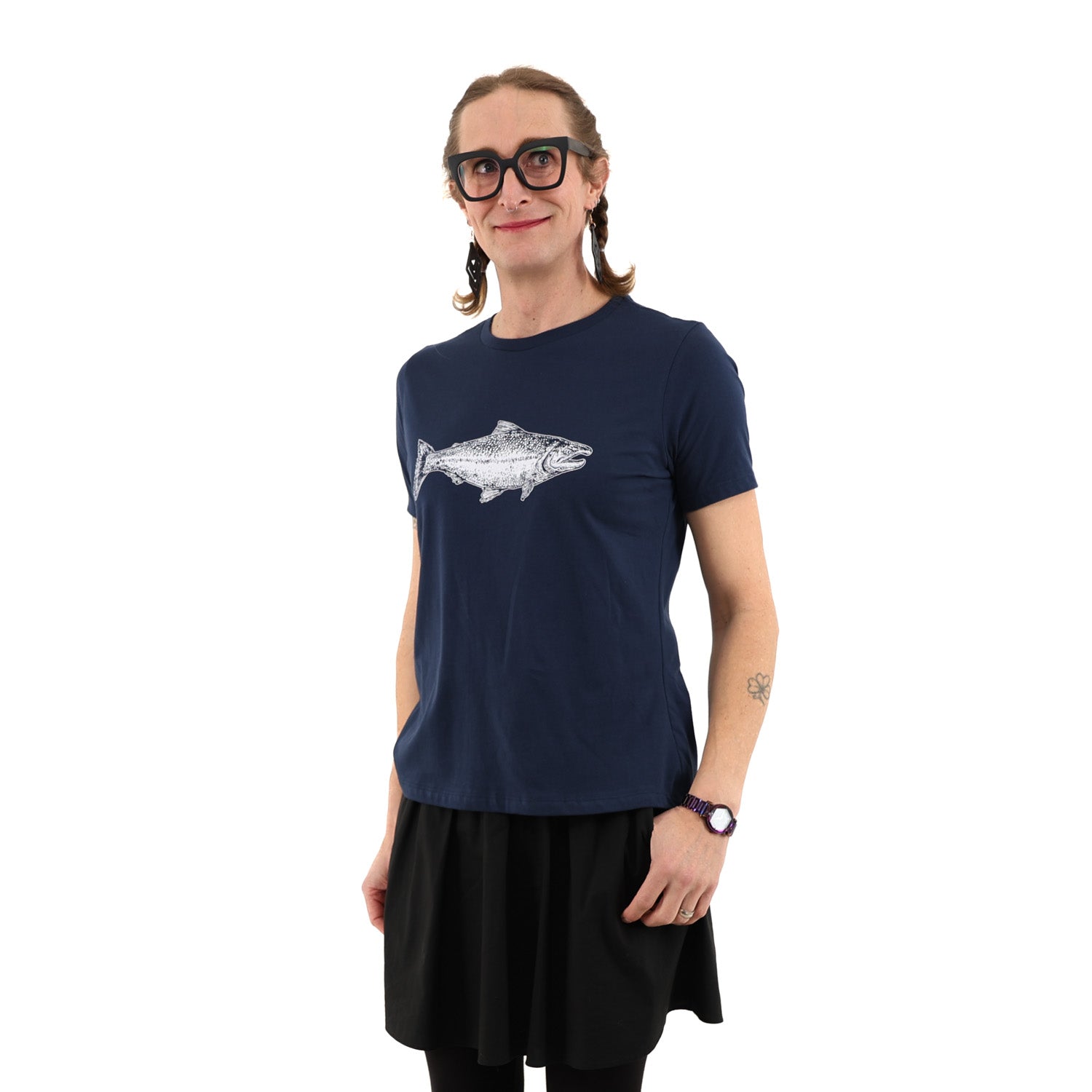 Woman wearing fitted navy blue t shirt with a salmon printed in white ink -