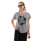 Woman wearing relax fit grey t shirt with orca whales printed in black ink