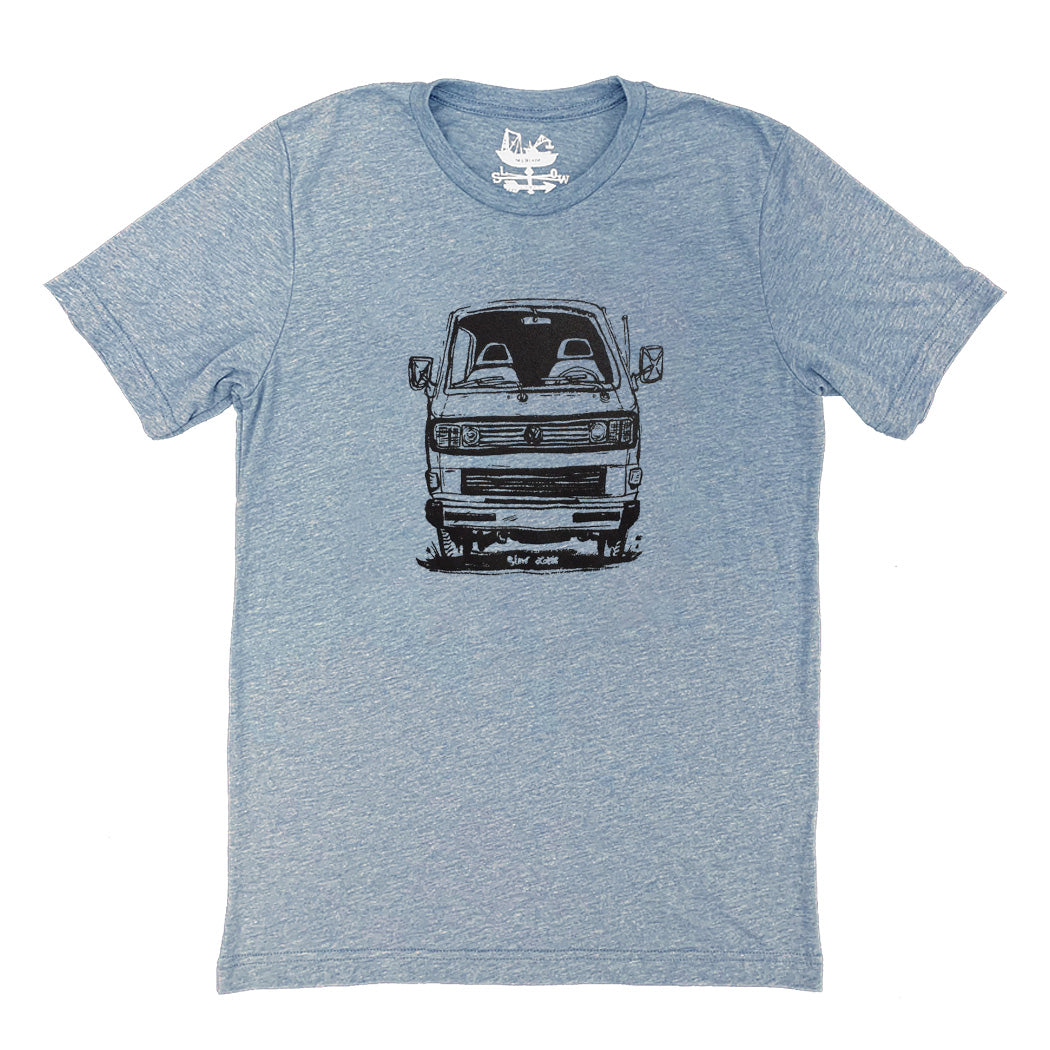 light blue t-shirt with black print of face on view of VW van