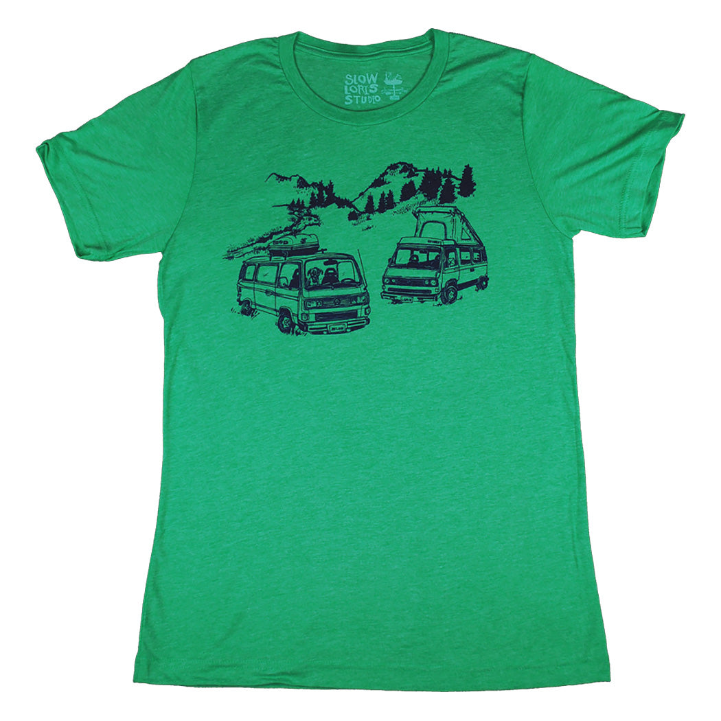 green t-shirt with print of two VW vans, one a pop top the other a tin top. Dog sitting in passenger seat of tin top
