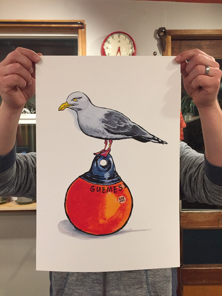13 by 19 inch colorful art print of a seagull standing on a buoy, held up at the corners for scale.