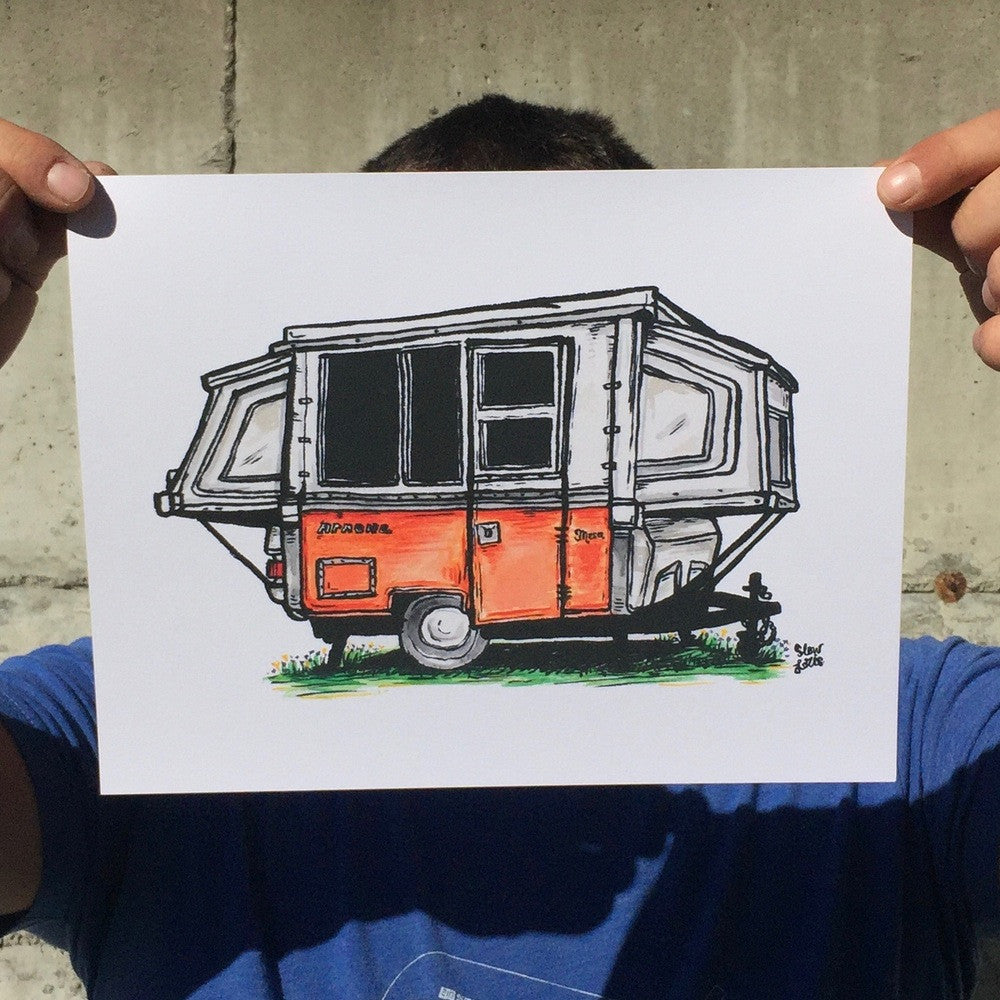 Art print painting of vintage orange Apache Mesa camper trailer, held up at the corners by pinched fingers.