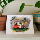 Greeting card printed with a colorful painting of an orange Boler camper, one of six designs in a set.