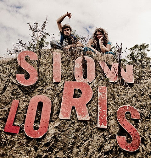 Slow Loris owners Jessica and Arlo sitting on a hill, for the Gift Card listing.