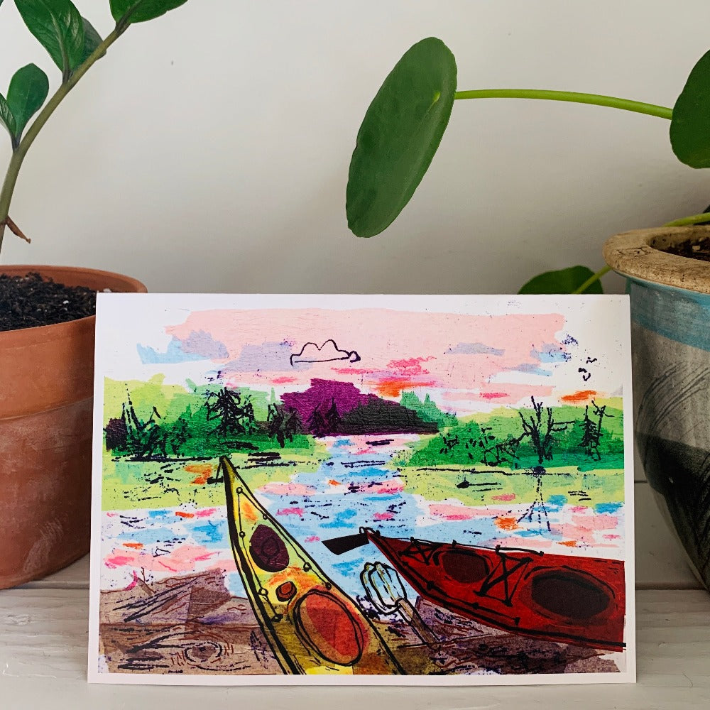 A greeting card featuring a colorful painting of kayaks on a beach. Part of our Island Life series.