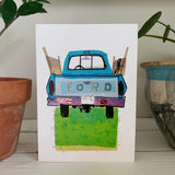 A greeting card featuring a colorful painting of an old blue truck. Part of our Island Life series. 
