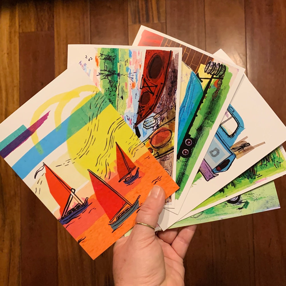 Greeting cards of the Island Life series, fanned out like playing cards.